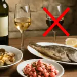 Come si abbina il vino giusto ai piatti di pesce tipici liguri? Gli errori che rovinano il sapore